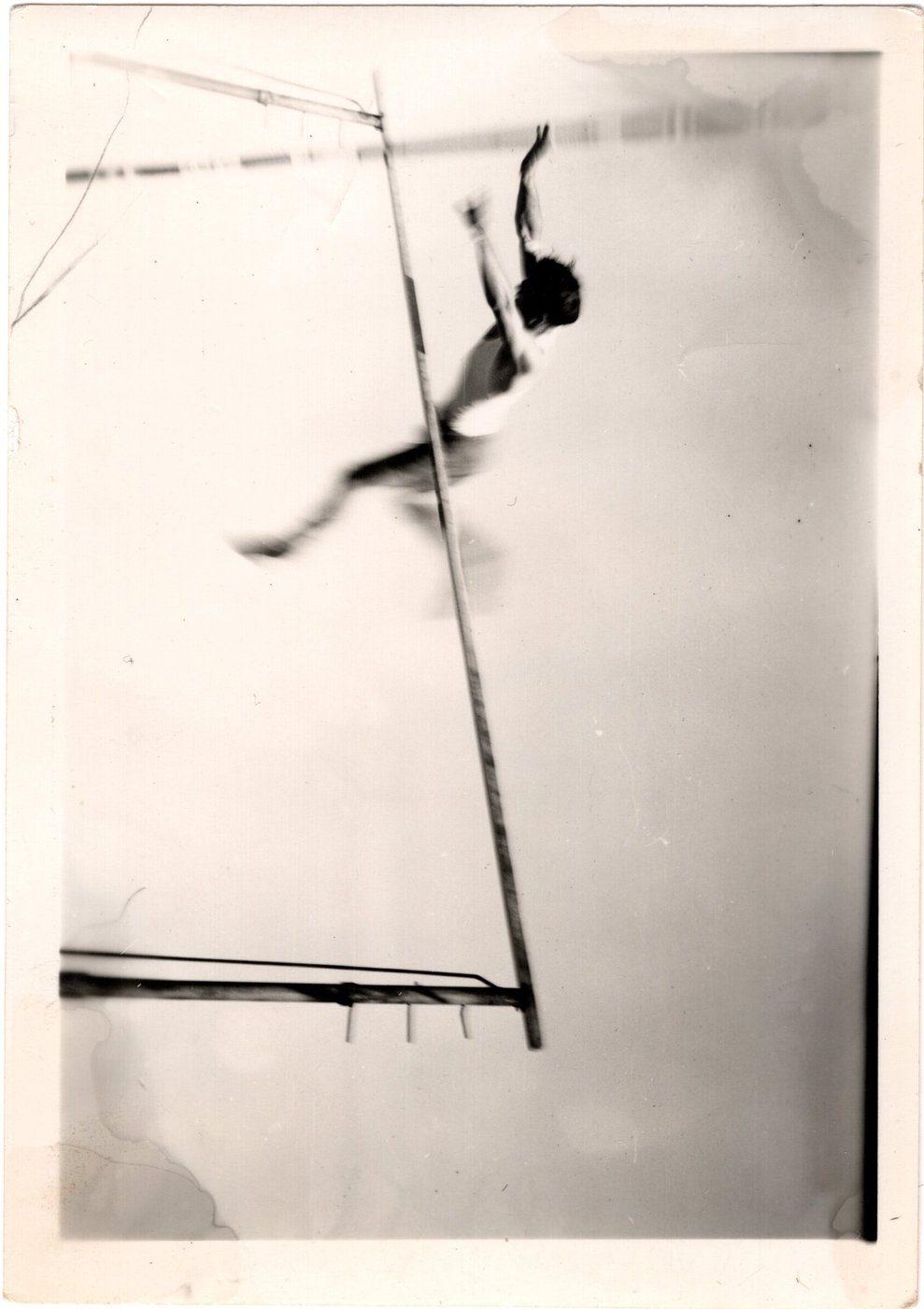 Benny Enea mid-vault, clearing the bar