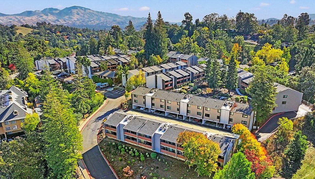 An aerial view of the Lafayette Highlands apartments among wooded hills