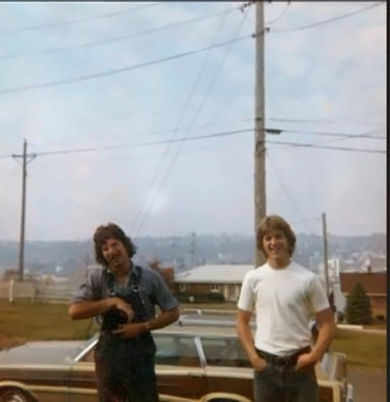 Charles Enea and Pat Maguire beside a station wagon, East Dubuque, Illinois, October 1974