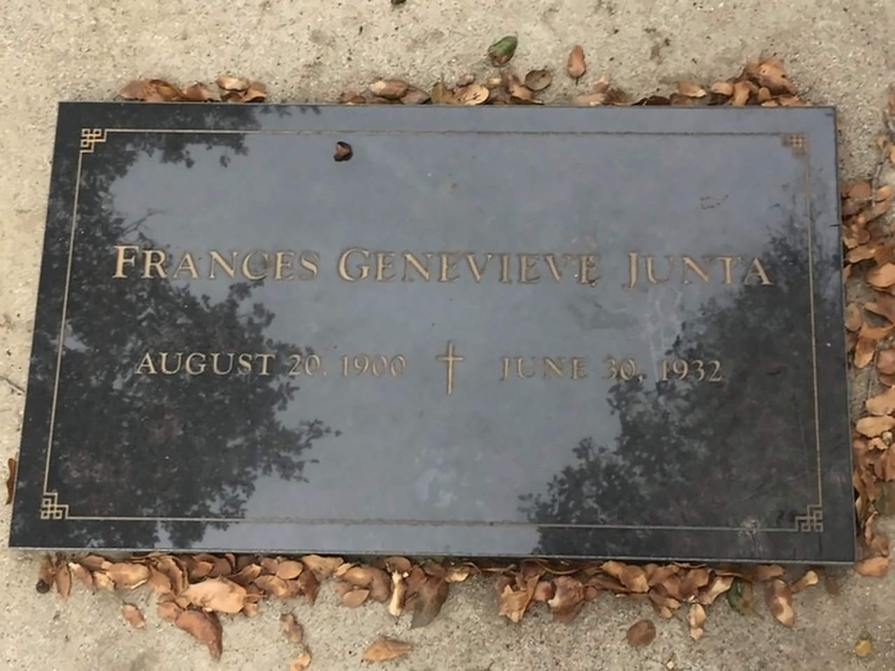 Bronze grave marker reading Frances Genevieve Junta