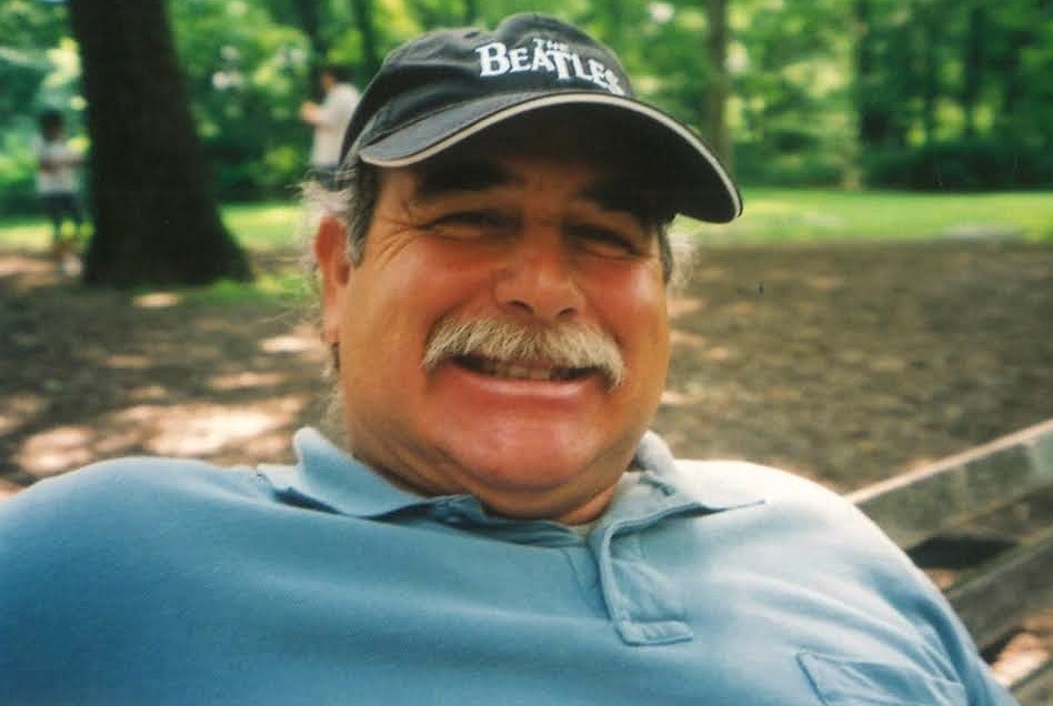 Fred Giambona wearing a Beatles cap