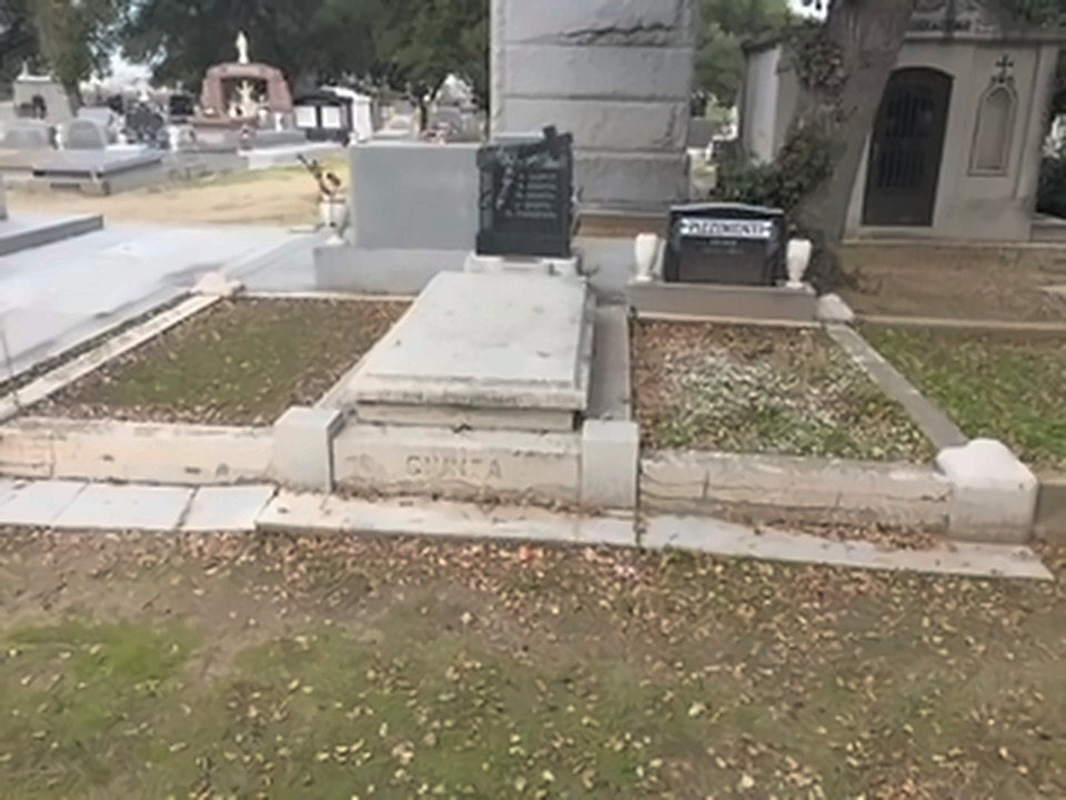 The Giunta family plot, with GIUNTA cut into the stone curb