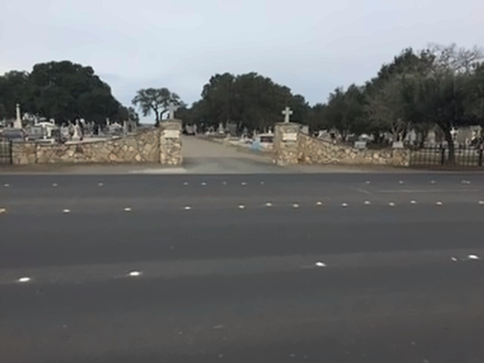 The stone entrance pillars of Holy Cross Cemetery in Antioch, California