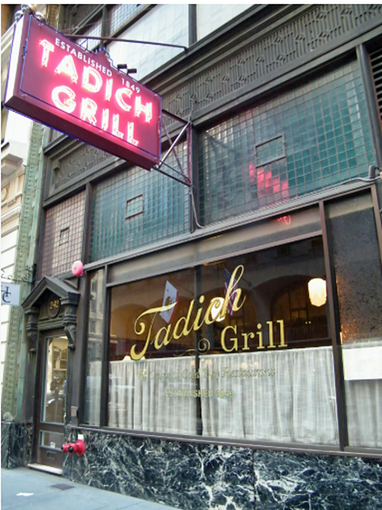 The Tadich Grill storefront with its hanging neon sign reading Established 1849